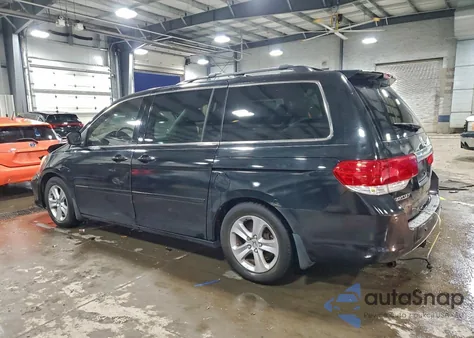 2010 Honda Odyssey Touring z USA, uszkodzony, nr VIN 5FNRL3H93AB057511